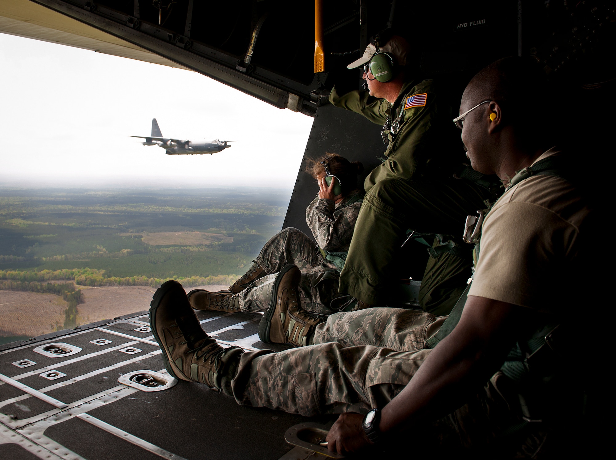 Members of the 919th Special Operations Wing watch the MC-130E Combat Talon I in flight April 15 during the aircraft’s final sortie before retirement. The last five Talons in the Air Force belong to the 919th SOW and are scheduled to be retired at a ceremony April 25.  They will make one final flight to the “boneyard” at Davis-Monthan Air Force Base, Ariz., by the end of the fiscal year.  (U.S. Air Force photo/Tech. Sgt. Samuel King Jr.)