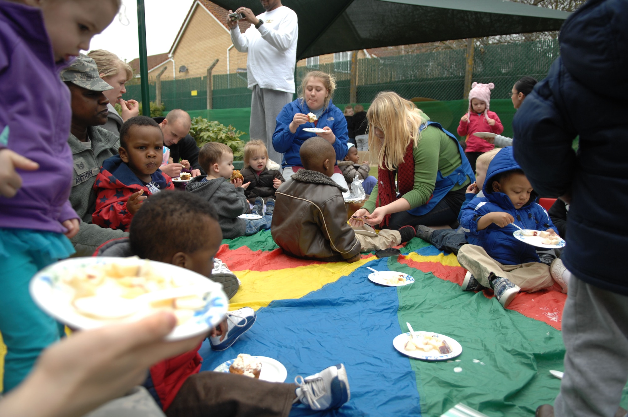 Team Mildenhall children and their parents participate in a snack picnic April 17, 2013, at the Child Development Center on RAF Mildenhall, England. Children helped prepare snacks for their parents during the event. (U.S. Air Force photo by Airman 1st Class Dillon Johnston/Released)