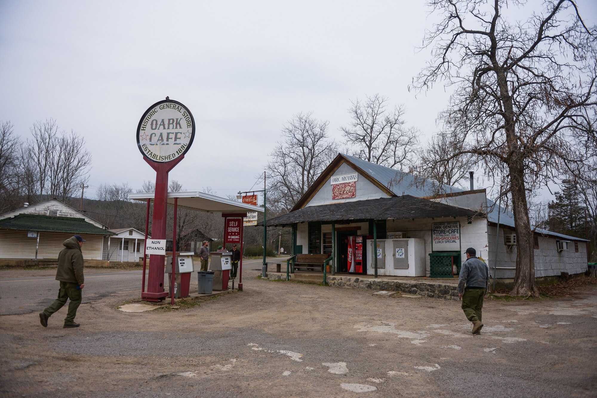 U.S. Forest Service workers walk to the Oark General Store March 8, 2013. The workers grabbed meals in the café, the oldest continually operating general store in Arkansas. 