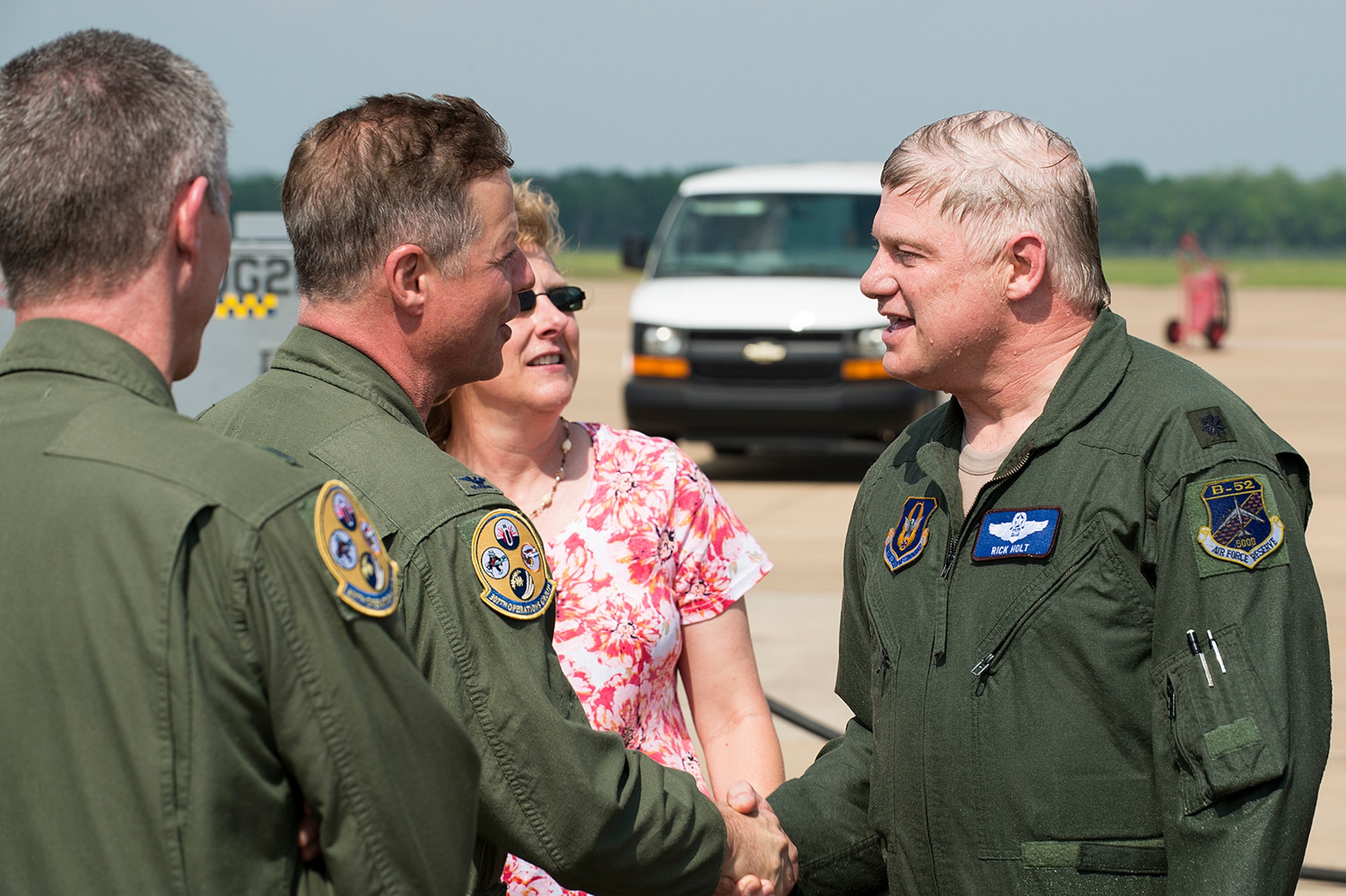 U.S. Air Force Col. Keith Schultz, 307th Operations Group commander, congratulates Lt. Col. Rick Holt upon his returning from his last flight in a B-52H Stratofortress, April 16, 2013, Barksdale Air Force Base, La. Holt is an Electronic Warfare Officer assigned to the 93rd Bomb Squadron and is retiring from the Air Force Reserve after 28 years of service and over 5,400 flying hours in the B-52. (U.S. Air Force photo by Master Sgt. Greg Steele/Released)