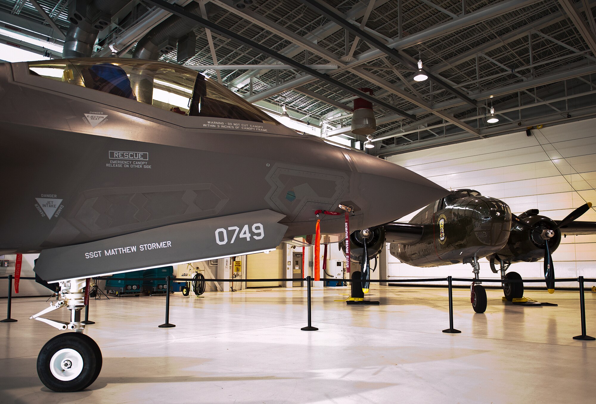 An F-35A Lightning II and the Doolittle Raiders’ B-25 are parked together for the 33rd Fighter Wing’s hangar dedication to Doolittle Raider, Lt. Col. Ed Saylor April 17 at Eglin Air Force Base, Fla.  After unveiling the plaque with his name on it, Saylor spoke about his experiences in the military and with the historic Raiders.  (U.S. Air Force photo/Samuel King Jr.)