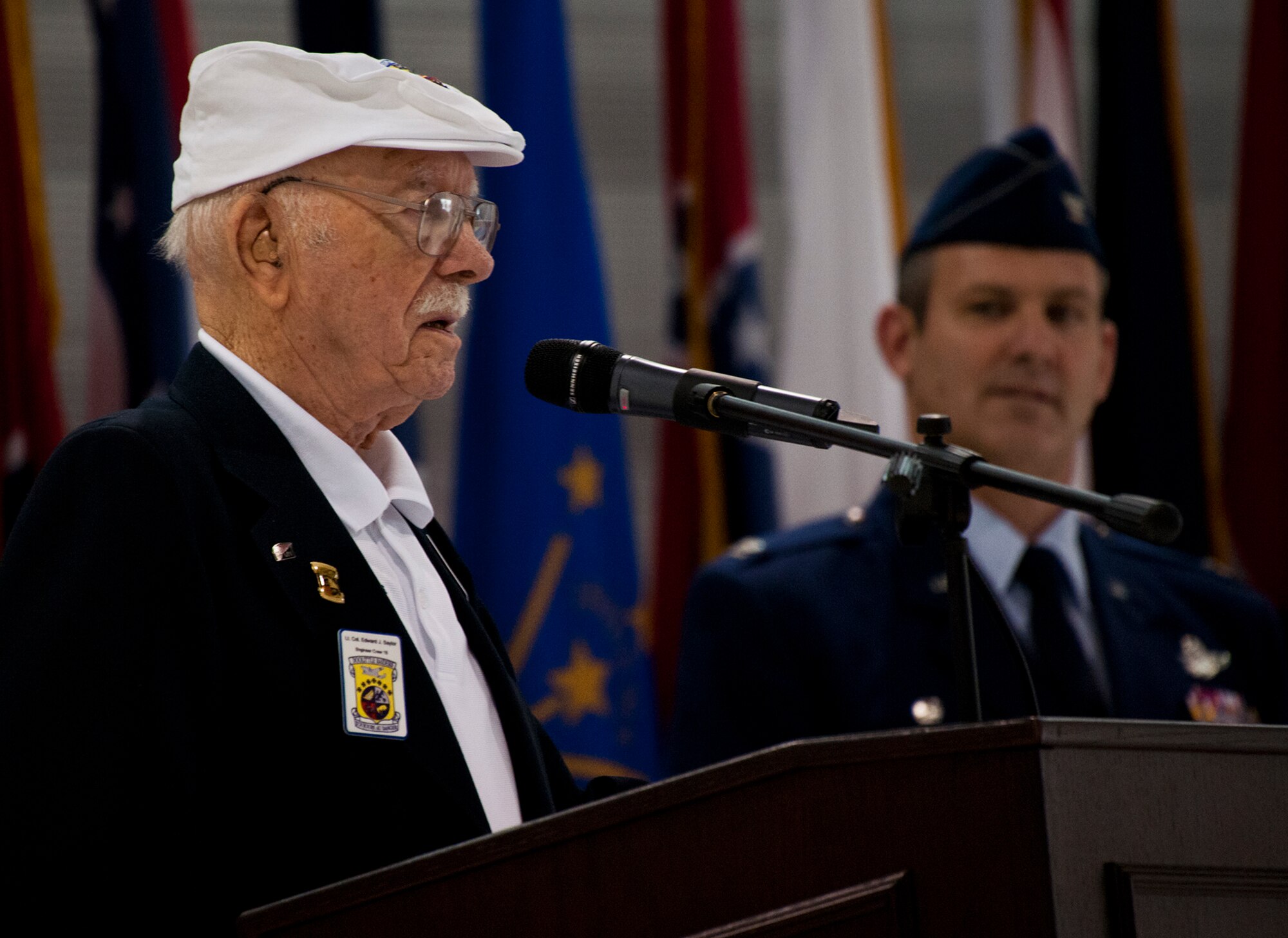 Doolittle Raider, Lt. Col. Ed Saylor, speaks to the crowd during a 33rd Fighter Wing hangar dedication in his honor April 17 at Eglin Air Force Base, Fla.  After unveiling the hangar plaque with his name on it, Saylor spoke about his experiences in the military and with the historic Raiders.  For the ceremony, an F-35A Lightning II and a Doolittle Raider B-25 were parked side by side in the hangar.  (U.S. Air Force photo/Samuel King Jr.)