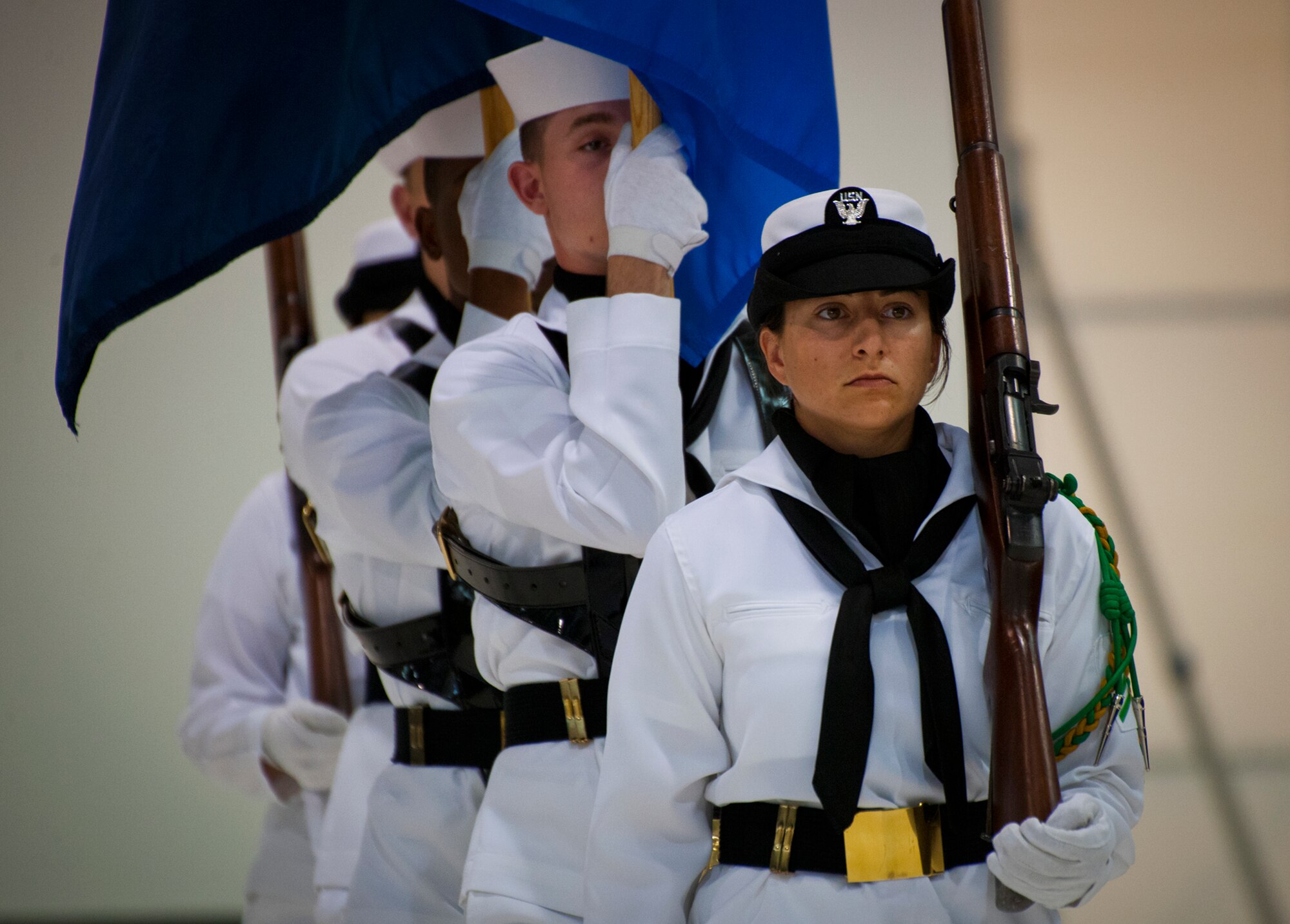 The Naval Hospital Pensacola honor guard team brings in the colors during the 33rd Fighter Wing’s hangar dedication ceremony in honor of Doolittle Raider, Lt. Col. Ed Saylor April 17 at Eglin Air Force Base, Fla.  After unveiling the plaque with his name on it, Saylor spoke about his experiences in the military and with the historic Raiders.  For the ceremony, an F-35A Lightning II and a Doolittle Raider B-25 were parked side by side in the hangar.  (U.S. Air Force photo/Samuel King Jr.)