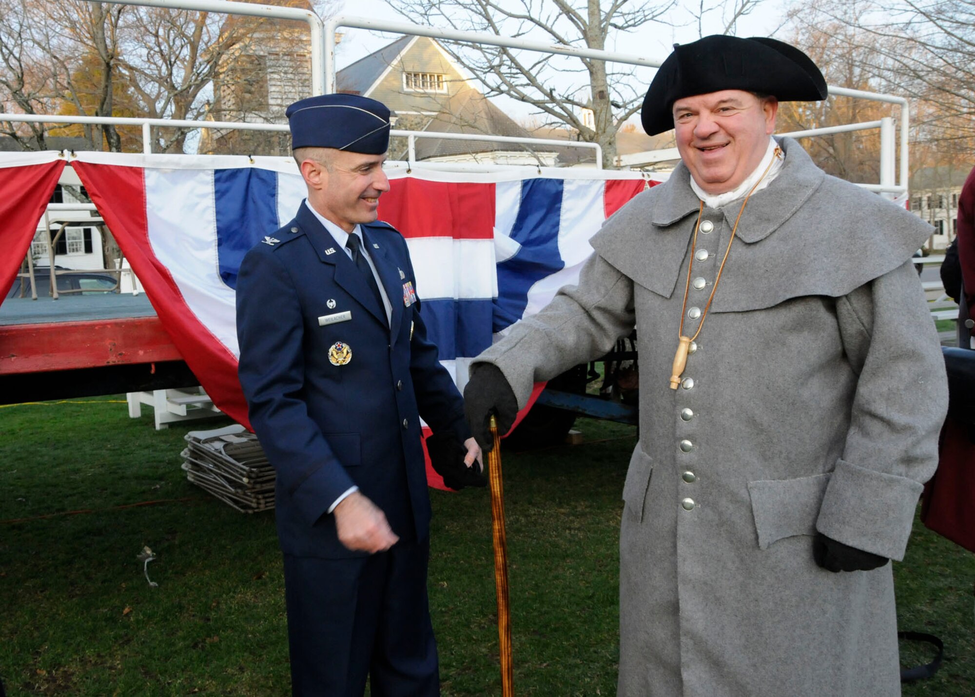 LEXINGTON, Mass. – Col. Lester A. Weilacher, 66th Air Base Group commander, checks out the clothing of Nick Zallas, installation antiterrorism officer, during a reenactment of the opening shots of the Revolutionary War April 15. Zallas hand stitched the period apparel and participated in Patriot’s Day activities. (U.S. Air Force photo by Linda LaBonte Britt)