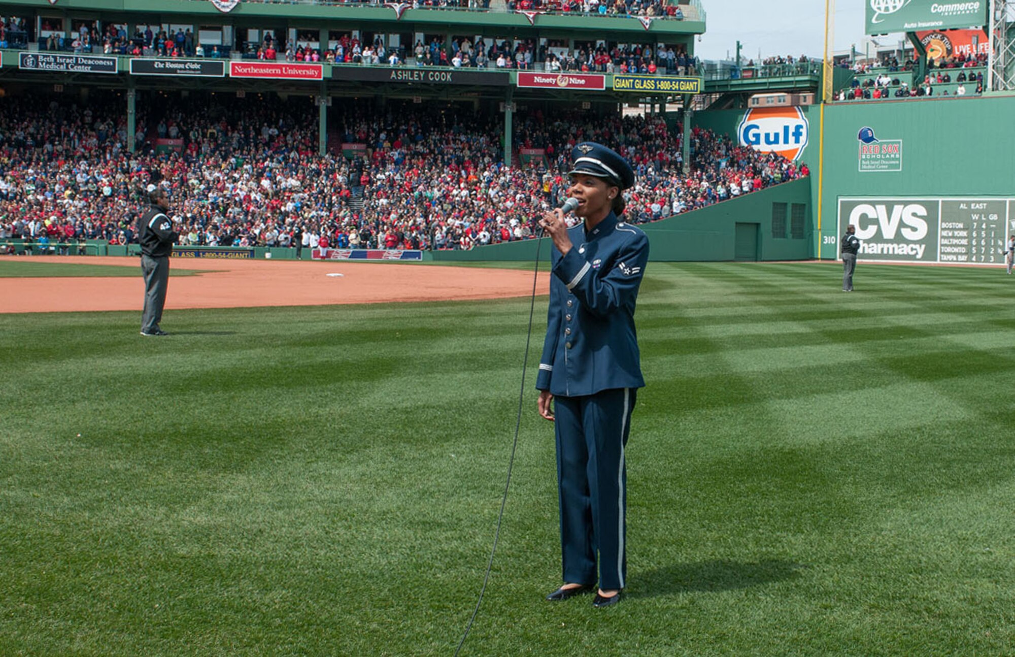 BOSTON – Airman 1st Class Ashley Cook, Air Force Band of Liberty vocalist, sings “God Bless America” at Fenway Park on Patriot’s Day April 15. Airmen from Hanscom also participated in the flag detail during the national anthem before the Red Sox game. (U.S. Air Force photo by Rick Berry)