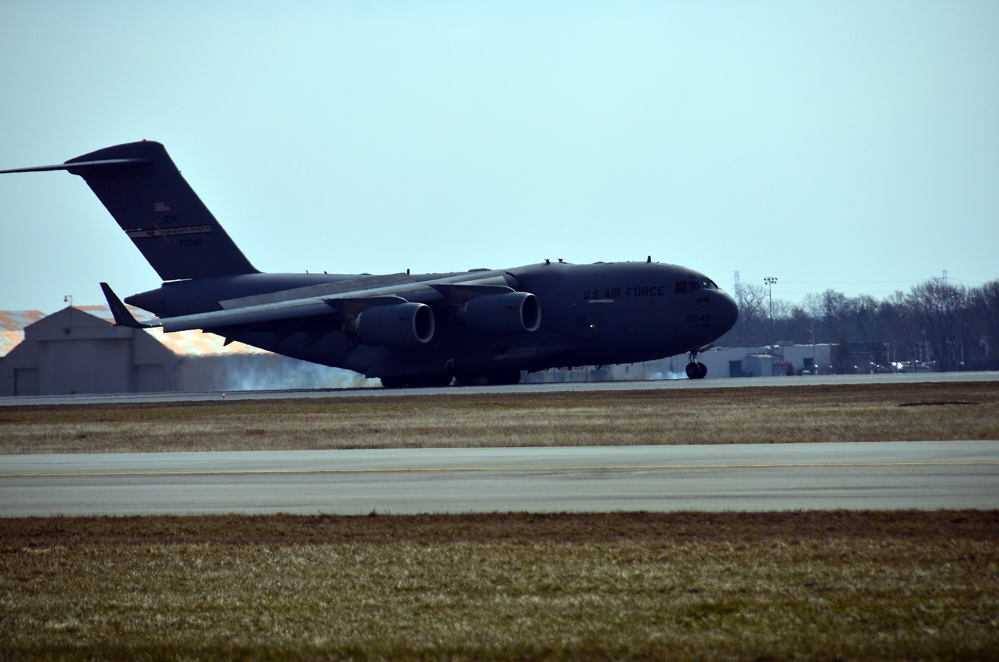 WRIGHT-PATTERSON AIR FORCE BASE, Ohio – A 445th Airlift Wing C-17 Globemaster III practices touch and gos during a routine training mission on a sunny day in April at Wright-Patterson Air Force Base, Ohio. Touch and gos involve landing on a runway and taking off again without coming to a full stop. (U.S. Air Force photo/Staff Sgt. Mikhail Berlin)