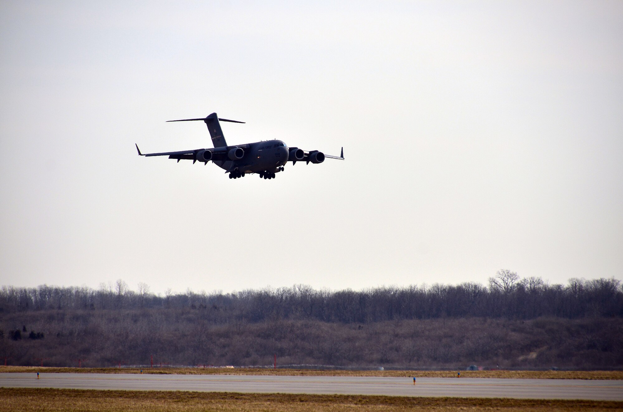 WRIGHT-PATTERSON AIR FORCE BASE, Ohio – A 445th Airlift Wing C-17 Globemaster III practices touch and gos during a routine training mission on a sunny day in April at Wright-Patterson Air Force Base, Ohio. Touch and gos involve landing on a runway and taking off again without coming to a full stop. (U.S. Air Force photo/Staff Sgt. Mikhail Berlin)