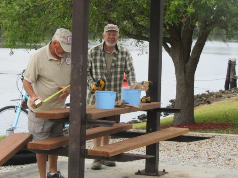 W.P. Franklin Lock volunteers measure twice and cut once when replacing re-planed boards in shelters. 