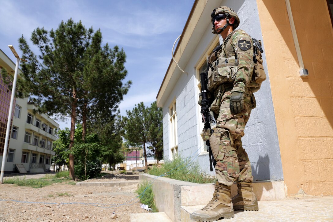 U.S. Army Sgt. Kyle Johnson provides security during a meeting with the Farah provincial council at the governor's compound in Farah City, Afghanistan, April 18, 2013. Johnson is assigned to Provincial Reconstruction Team Farah.