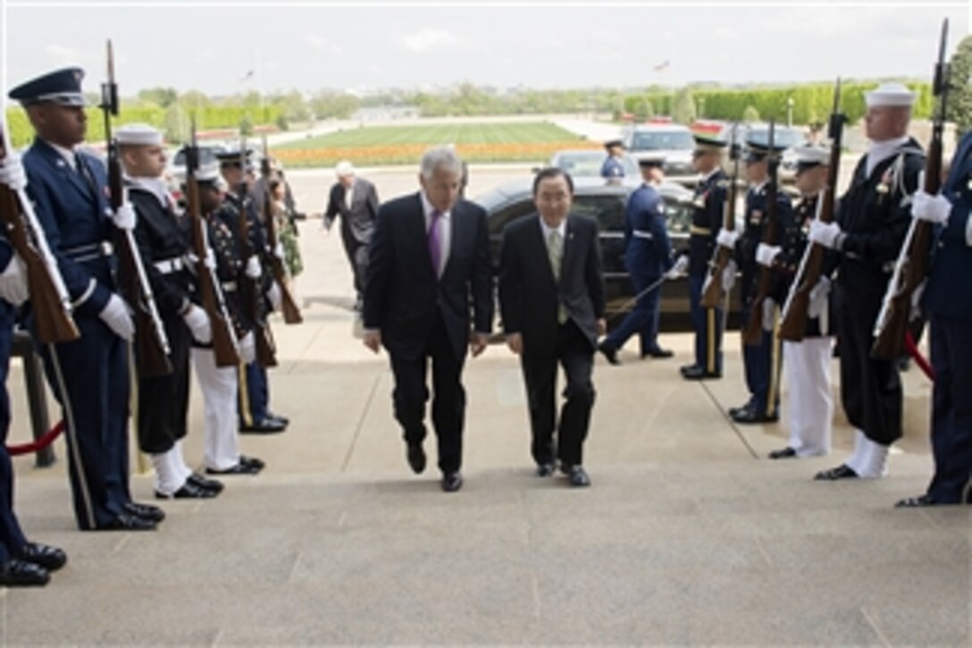 Secretary of Defense Chuck Hagel, left, escorts Secretary-General of the United Nations Ban Ki-moon through an honor cordon and into the Pentagon in Arlington, Va., on April 18, 2013.  Hagel, Ban and their senior advisers will meet to discuss international security issues.  