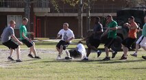 Servicemembers with Combat Logistics Battalion 2, 2nd Marine Logistics Group play soccer during a post-deployment field meet aboard Camp Lejeune, N.C., April 11, 2013. Marines and sailors rotated between playing basketball, soccer, and kickball.(U.S. Photo by Lance Cpl. Shawn Valosin)