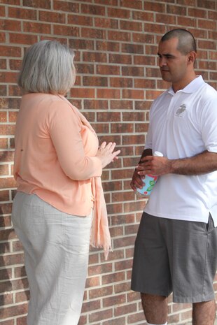 A Marine with Combat Logistics Battalion 2, 2nd Marine Logistics Group, speaks with a military family life counselor during a field meet aboard Camp Lejeune, N.C., April 11, 2013. Counselors were invited to the field meet so they could speak with servicemembers who recently returned from a six-month deployment. (U.S. Photo by Lance Cpl. Shawn Valosin)