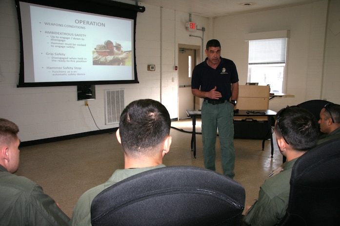 Bill Norton, an Ordnance Test Facility equipment specialist, teaches members of the Marine Corps Base Quantico Special Reaction Team how to operate the M45A1 Close Quarters Battle Pistol during a New Equipment Training class April 10. The pistol replaces the Marine Expeditionary Unit (Special Operations Capable) .45-caliber pistol, and will be fielded to Marine Corps Special Operations Command, reconnaissance organizations and military police special response teams across the Marine Corps.