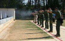 The Marine Corps Base Quantico Special Response Team and Marines from the Weapons Training Battalion fire the M45A1 Close Quarters Battle Pistol during a New Equipment Training class April 10. The pistol replaces the Marine Expeditionary Unit (Special Operations Capable).45-caliber pistol, and will be fielded to Marine Corps Special Operations Command, reconnaissance organizations and military police special response teams across the Marine Corps.