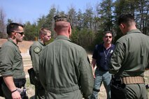 Bill Norton, an Ordnance Test Facility equipment specialist, talks to members of the Marine Corps Base Quantico Special Reaction Team following a New Equipment Training class for the M45A1 Close Quarters Battle Pistol April 10. The pistol replaces the Marine Expeditionary Unit (Special Operations Capable) .45-caliber pistol, and will be fielded to Marine Corps Special Operations Command, reconnaissance organizations and military police special response teams across the Marine Corps.