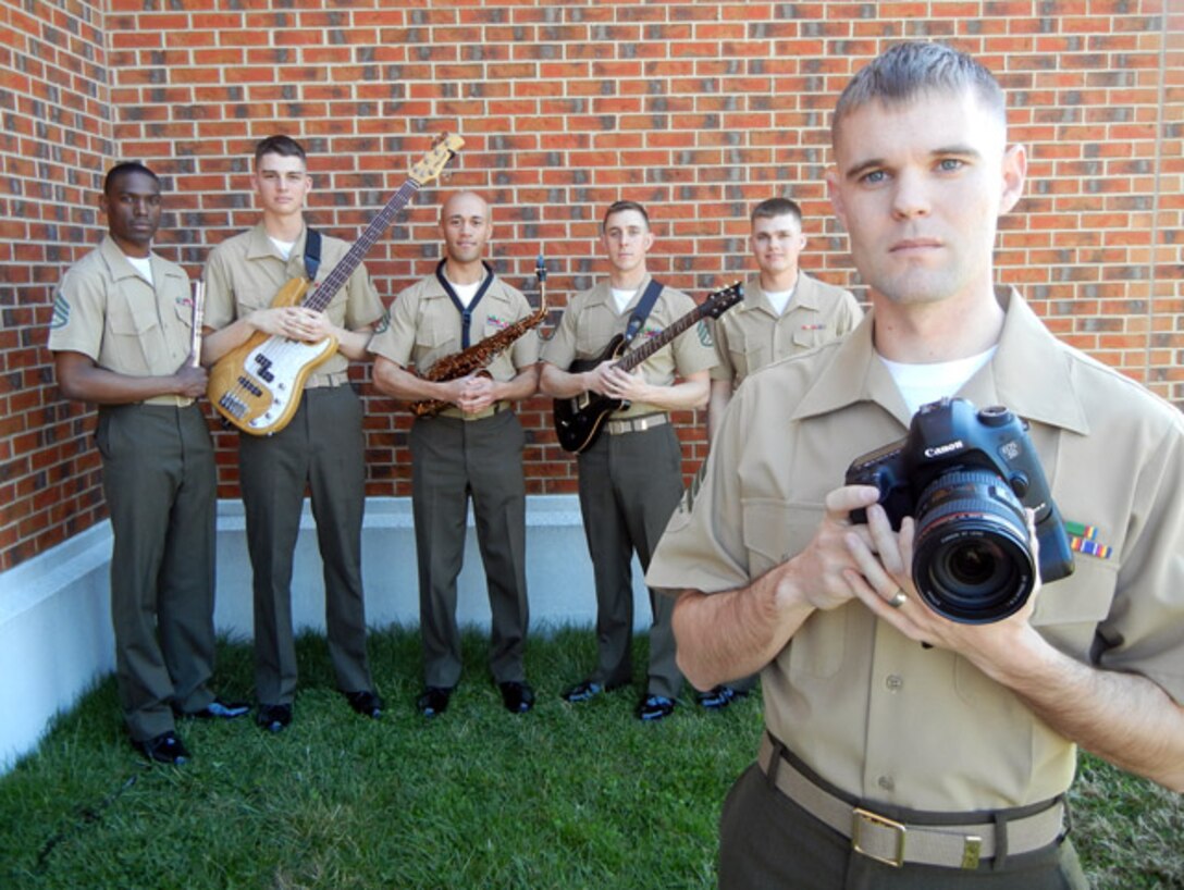 Sgt. A.J. Rasure, photographer and Public Affairs representative for the Quantico Marine 
Corps Band, stands with band members outside the Alfred M. Gray Marine Corps Research Center on April 7, 2013, where they gave a performance. 