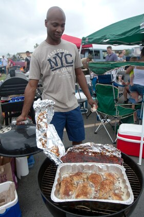 MARINE CORPS BASE HAWAII - Lance Cpl. Durran Goodwin, a legal services support clerk with Headquarters Battalion, shows off his beef brisket at the Headquarters Bn. barbecue competition, April 12, 2013. (U.S. Marine Corps photo by Lance Cpl. Janelle Y. Chapman)