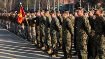 Marines and Sailors with Black Sea Rotational Force 13 hold an opening ceremony for the start of exercise Summer Shield 10 aboard Camp Adazi, April 15, 2013.  Exercise Summer Shield 10 focuses on integration of fires and maneuver in a joint environment to build partner nation capacity while enhancing our interoperability between the United States and Latvia.(U.S. Marine Corps photo by Lance Cpl. Michael Dye/released)