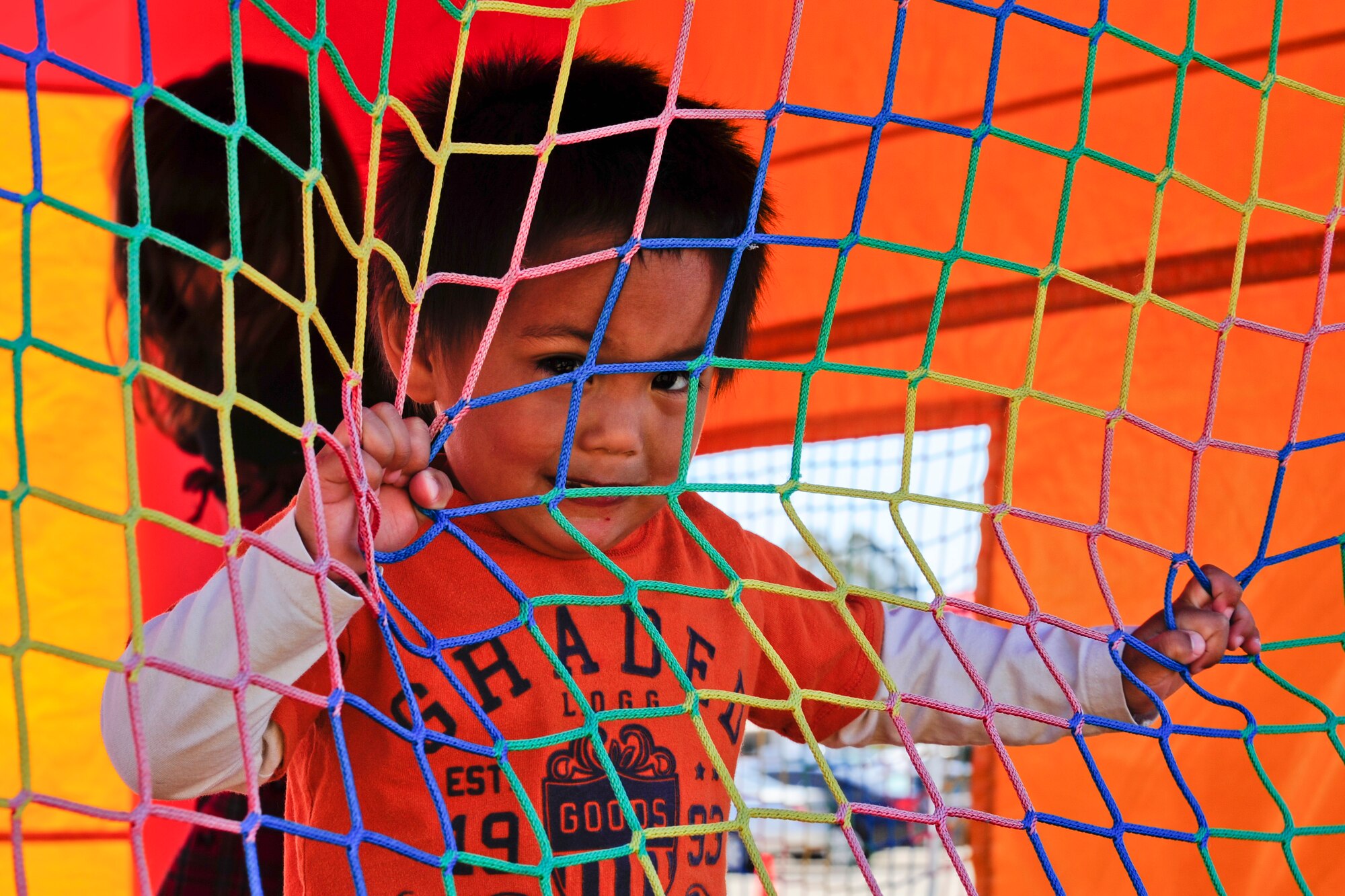 VANDENBERG AIR FORCE BASE, Calif. – The son of Marc Dalope, a 30th Civil Engineer Squadron power pro craftsman, plays in a bounce house during the 13th annual Earth Day event here Thursday, April 18, 2013. Celebrated by millions of people on April 22, Earth Day promotes awareness and appreciation for the environment. (U.S. Air Force photo/Airman Yvonne Morales)