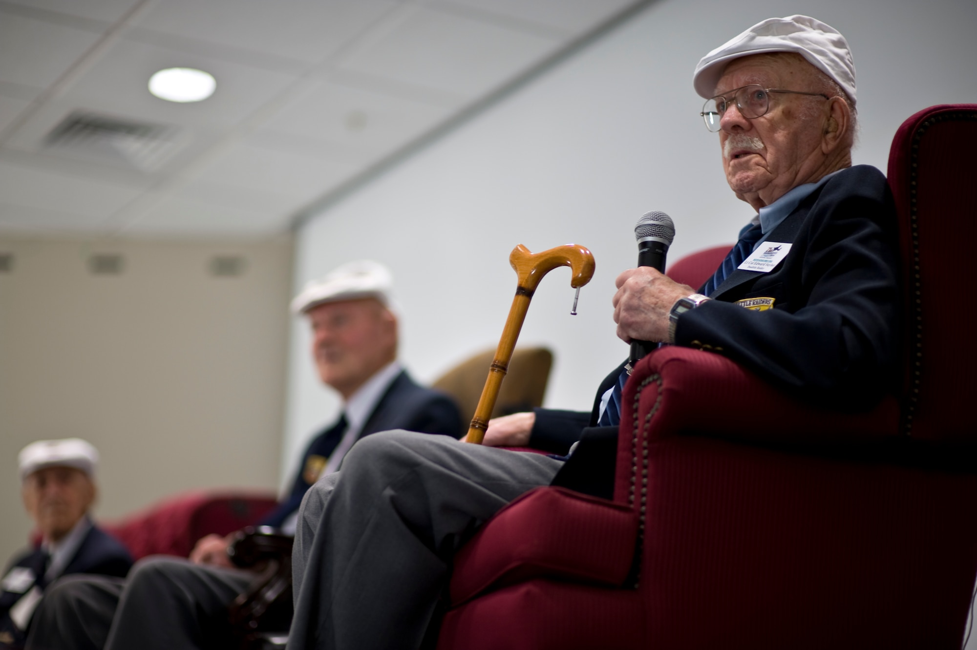 Retired U.S. Air Force Lt. Col. Edward Saylor, one of the Doolittle Raiders, left, makes a point about military service during a session at the 319th Special Operations Squadron auditorium at Hurlburt Field, Fla., April 18, 2013. Dozens of Hurlburt Airmen gathered at the auditorium to listen to Saylor and his fellow Doolittle Raiders on the 71st anniversary of their mission. (U.S. Air Force Photo/Airman 1st Class Hayden K. Hyatt)