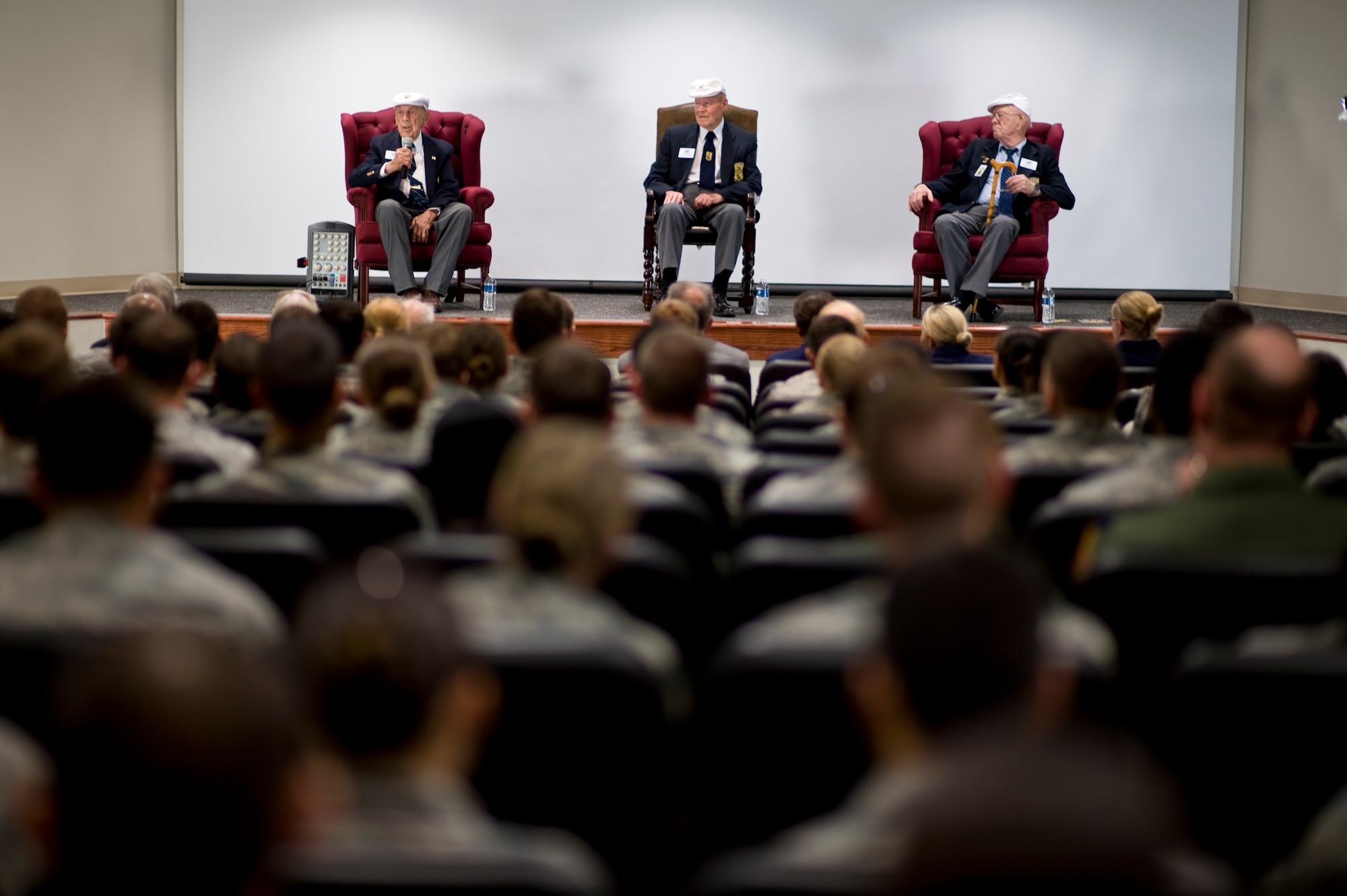 Retired U.S. Air Force Lt. Col Richard Cole, left, Staff Sgt. David Thatcher, center, and Lt. Col. Edward Saylor, right, all of the Doolittle Raiders, answer questions from Hurlburt Field Airmen at the 319th Special Operations Squadron auditorium at Hurlburt Field, Fla., April 18, 2013. The surviving Doolittle Raiders visited Fort Walton Beach, Fla., for their reunion tour as part of the 71st anniversary of this historic mission. (U.S. Air Force Photo/Airman 1st Class Hayden K. Hyatt)