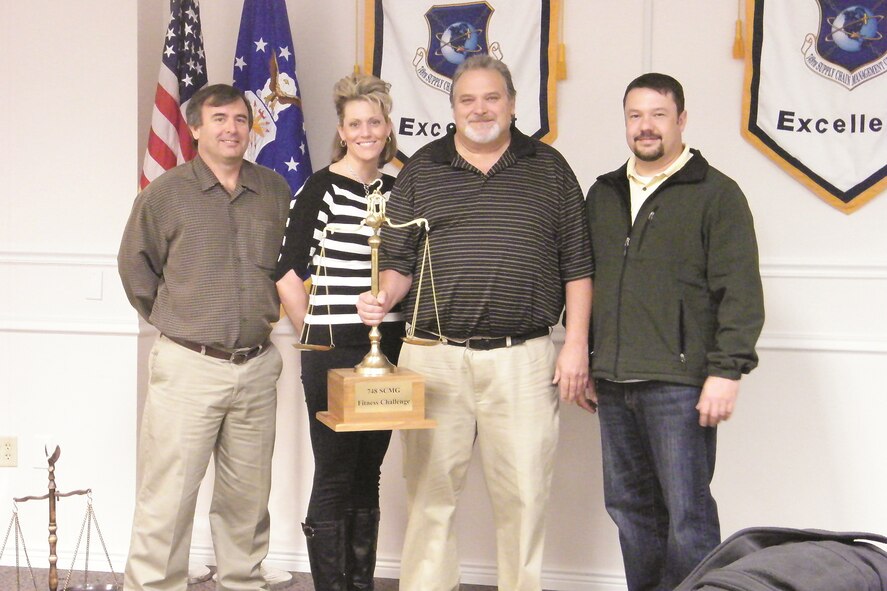 The four-person winning team in the 748th Supply Chain Management Group fitness competition is the 416th Supply Chain Management Squadron. They are (from left to right) Anthony Mceuen, Trisha Hamilton, Randy Neilson and Jonathon Shields. (Photo by Mikayla Beyer)