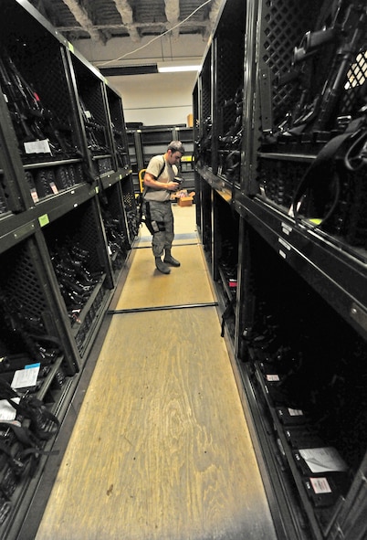 Senior Airman Brian Winker, 509th Security Forces Squadron armorer, organizes M4 carbine equipment in the armory at Whiteman Air Force Base, Mo., March 25, 2013. Winker is responsible for knowing the whereabouts of more than 1,000 weapons valuing in excess of $5 million. (U.S. Air Force photo by Staff Sgt. Nick Wilson/Released)  