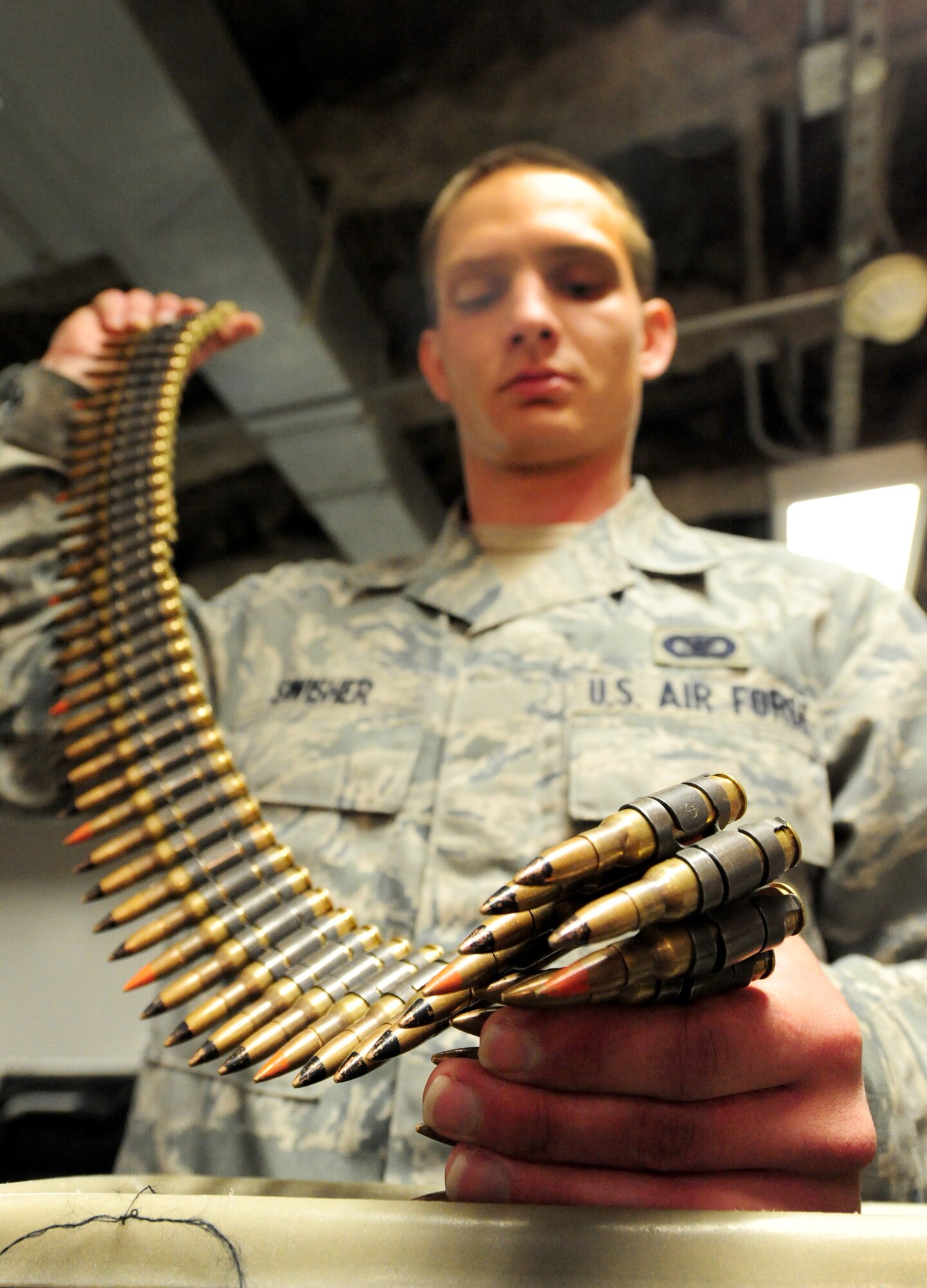 Airman Brandon Swisher, 509th Security Forces Squadron response force member, counts M240 machine gun rounds in the armory during his 12-hour shift at Whiteman Air Force Base, Mo., March 25, 2013.  The armory is a safe and secure location on base to store weapons. (U.S. Air Force photo by Staff Sgt. Nick Wilson/Released) 