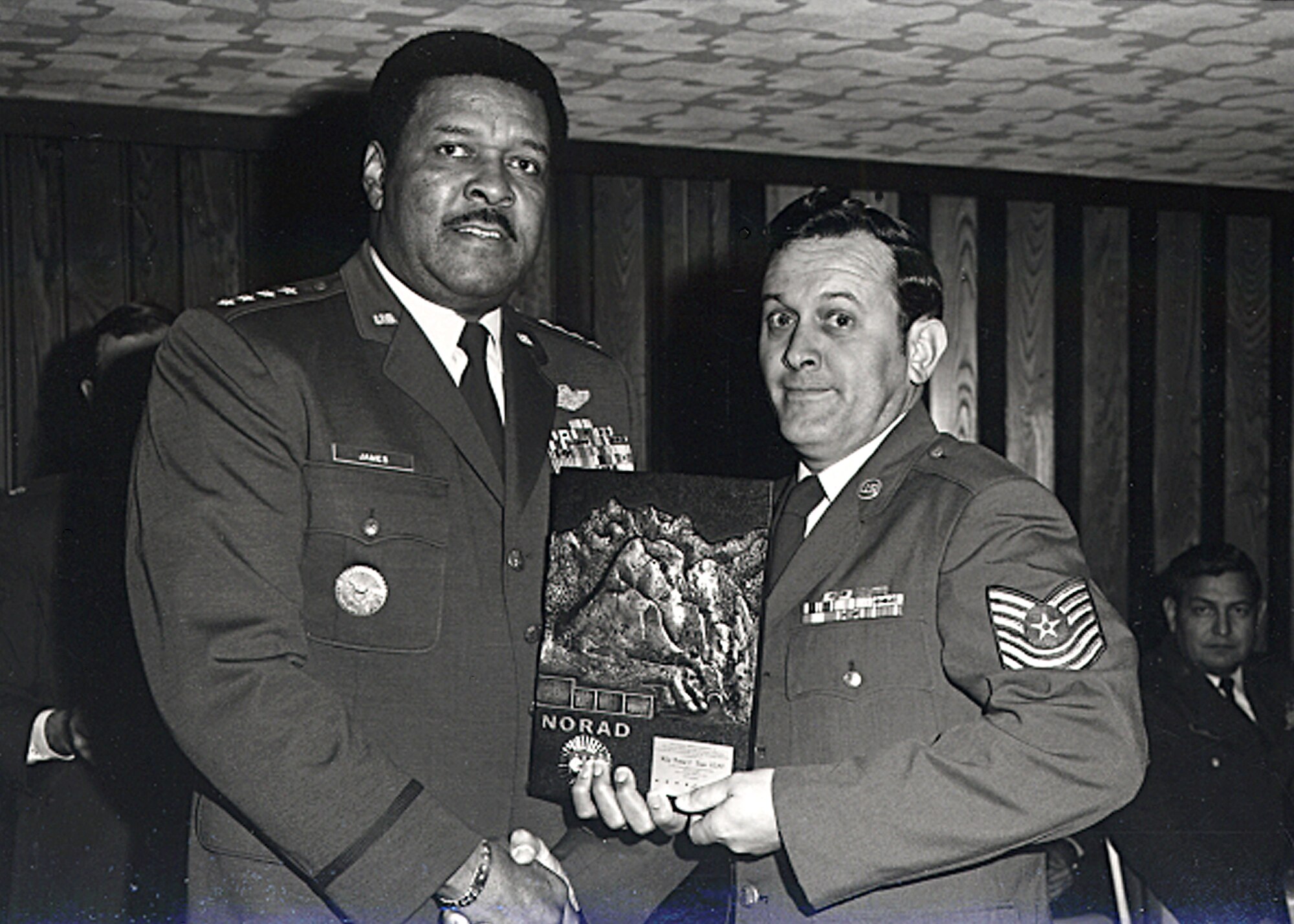 Master Sgt. Richard Bayne receives an award from Gen. Daniel “Chappie” James Jr. during an assignment at Peterson AFB. Bayne, who retired from the Air Force in 1994 as a Chief Master Sgt. with 33 years of active duty service, is retiring from civil service April 30 after 52 years of total combined service to the U. S. Air Force. (Courtesy Photo)