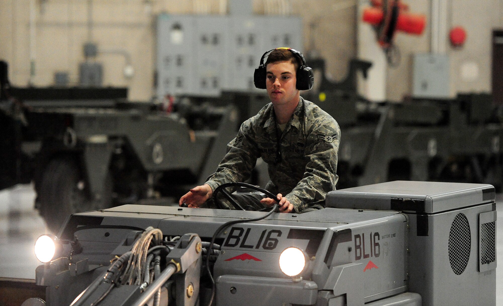 Airman 1st Class Justin Sutherland, 13th Aircraft Maintenance Unit weapons loader, uses a jammer to place a munition in the weapons bay of a B-2 Spirit during a weapons load competition at Whiteman Air Force Base, Mo., April 12, 2013. The crews were evaluated on safety, reliability, dress and appearance, a knowledge-based test and tool kits, as well as by which team completed the most technically accurate weapons load. (U.S. Air Force photo by Staff Sgt. Nick Wilson/Released) 