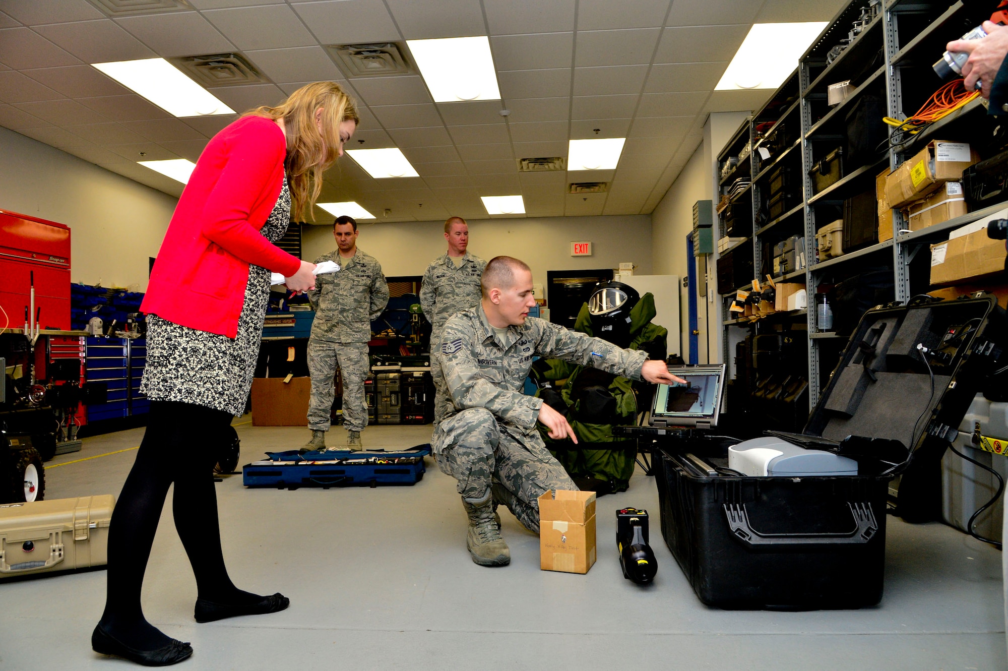 Staff Sgt. Benjamin McGovern, from the 436th Civil Engineer Squadron Explosive Ordnance Disposal Flight, demonstrates the XRS-300 portable X-ray system used by him and his team to render explosives safe at Dover Air Force Base, Del., April 16, 2013.  The Media Day was an opportunity for media representatives to get a closer look at and a better understanding of Dover AFB's EOD Airmen and mission. (U.S. Air Force photo/David S. Tucker)
