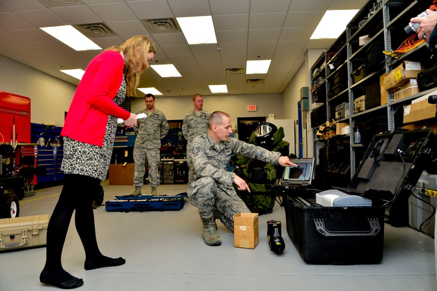 Staff Sgt. Benjamin McGovern, from the 436th Civil Engineer Squadron Explosive Ordnance Disposal Flight, demonstrates the XRS-300 portable X-ray system used by him and his team to render explosives safe at Dover Air Force Base, Del., April 16, 2013.  The Media Day was an opportunity for media representatives to get a closer look at and a better understanding of Dover AFB's EOD Airmen and mission. (U.S. Air Force photo/David S. Tucker)
