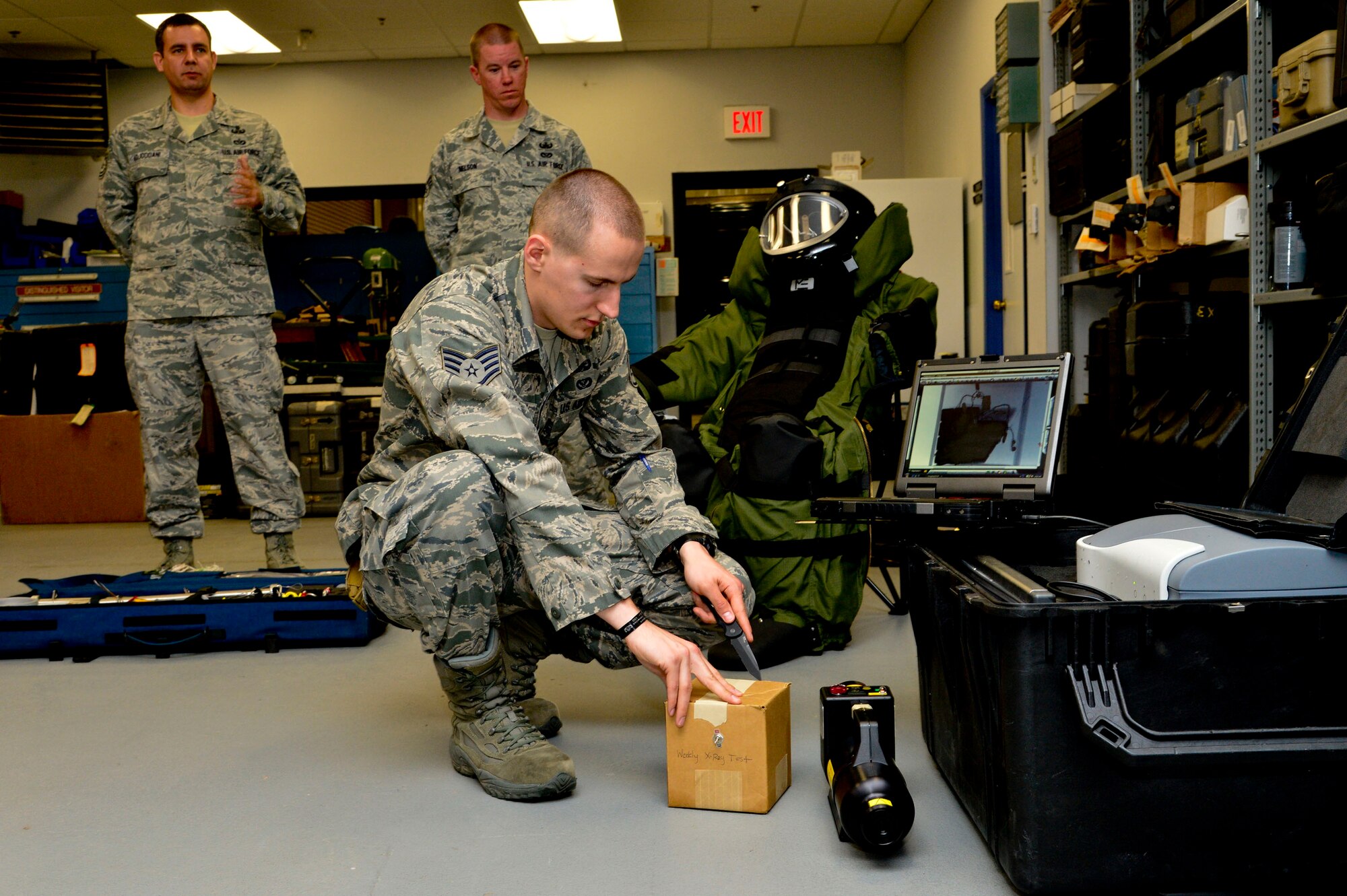 Staff Sgt. Benjamin McGovern, from the 436th Civil Engineer Squadron Explosive Ordnance Disposal Flight, demonstrates the XRS-300 portable X-ray system used by him and his team to render explosives safe at Dover Air Force Base, Del., April 16, 2013. The Media Day was an opportunity for media representatives to get a closer look at and a better understanding of Dover AFB's EOD Airmen and mission.  (U.S. Air Force photo/David S. Tucker)
