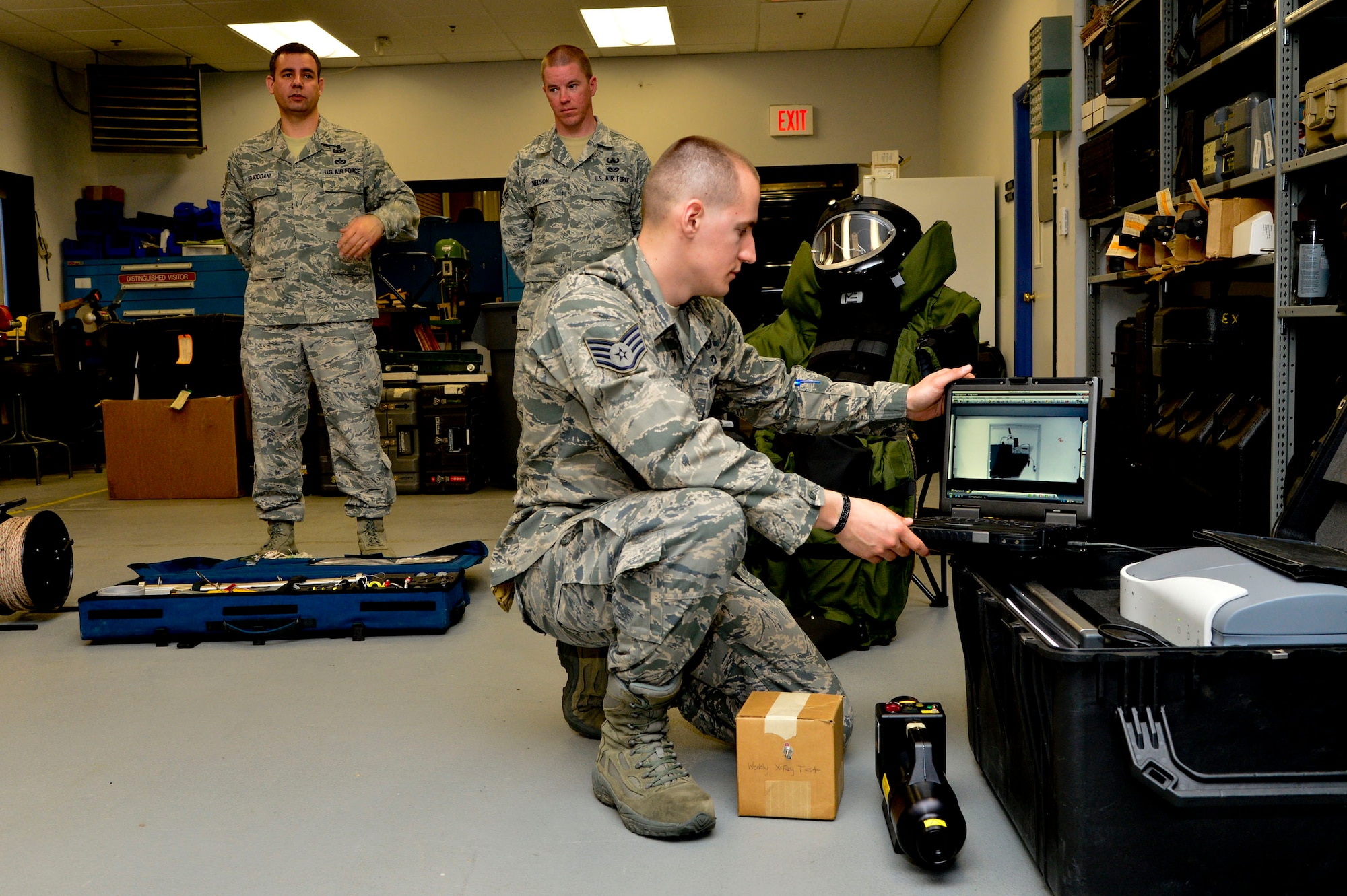 Staff Sgt. Benjamin McGovern, from the 436th Civil Engineer Squadron Explosive Ordnance Disposal Flight, demonstrates the XRS-300 portable X-ray system used by him and his team to render explosives safe at Dover Air Force Base, Del., April 16, 2013. The Media Day was an opportunity for media representatives to get a closer look at and a better understanding of Dover AFB's EOD Airmen and mission.  (U.S. Air Force photo/David S. Tucker)
