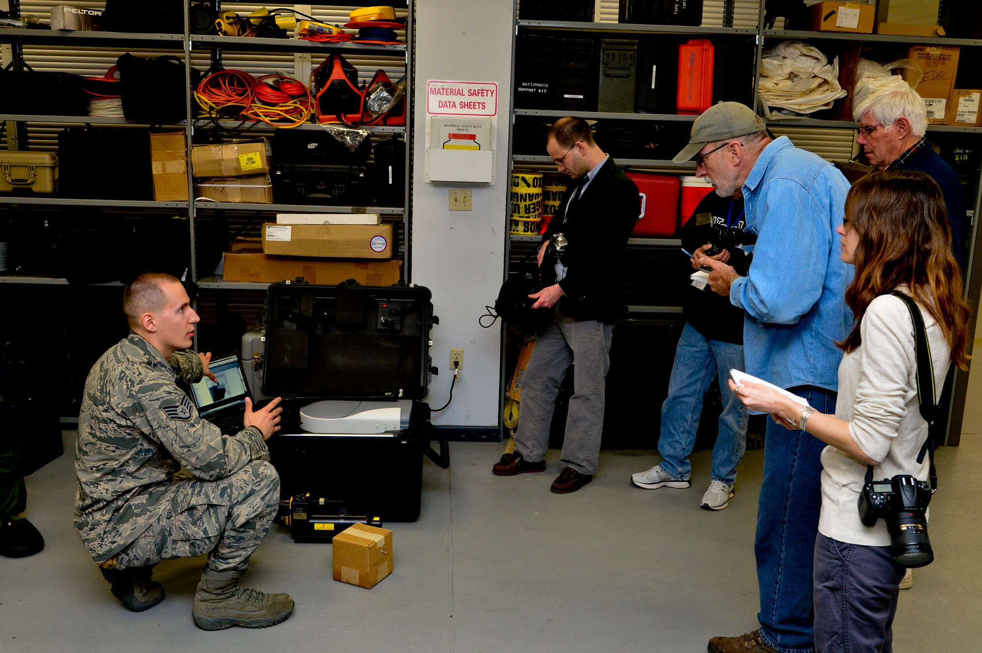 Staff Sgt. Benjamin McGovern, from the 436th Civil Engineer Squadron Explosive Ordnance Disposal Flight, demonstrates the XRS-300 portable X-ray system used by him and his team to render explosives safe at Dover Air Force Base, Del., April 16, 2013. The Media Day was an opportunity for media representatives to get a closer look at and a better understanding of Dover AFB?s EOD Airmen and mission.  (U.S. Air Force photo/David S. Tucker)
