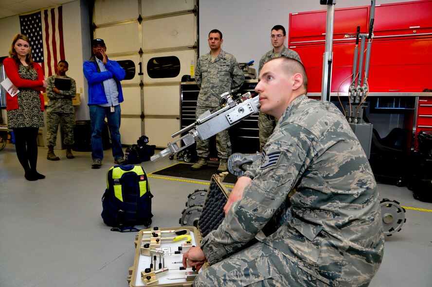 Staff Sgt. Benjamin McGovern, from the 436th Civil Engineer Squadron Explosive Ordnance Disposal Flight, demonstrates support equipment used by him and his team to render explosives safe at Dover Air Force Base, Del., April 16, 2013. The Media Day was an opportunity for media representatives to get a closer look at and a better understanding of Dover AFB's EOD Airmen and mission.
 (U.S. Air Force photo/David S. Tucker)
