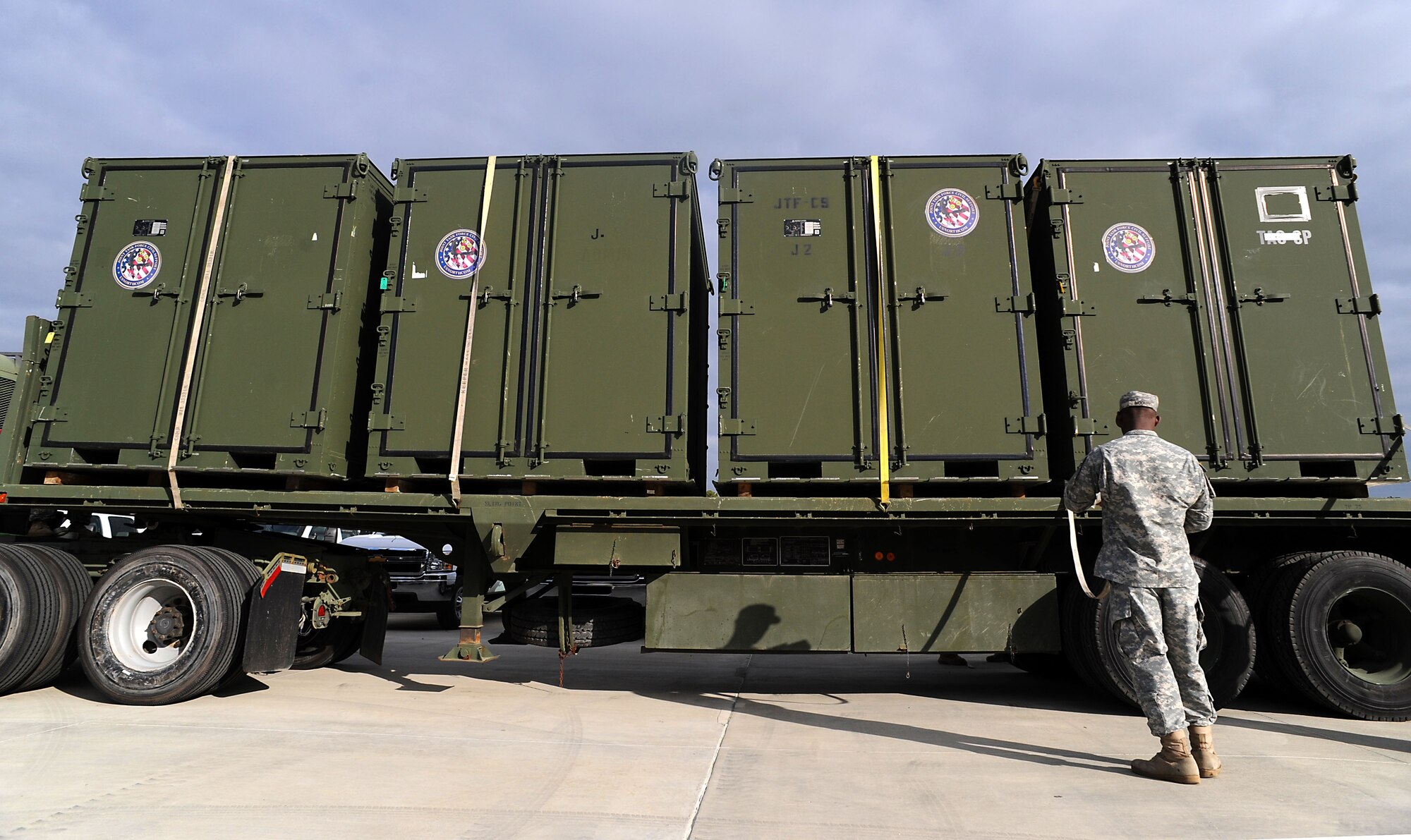 Soldiers from the 149th Transportation Company, 10th Trans. Battalion transport part of the 130 short tons of equipment and supplies as part of a Joint Task Force Civil Support deployment readiness exercise at Fort Eustis, Va., April 16, 2013. The four-day exercise was part of a "crawl, walk, run" process JTF-CS is undertaking this year in an effort to validate its ability to respond quickly and enable the Response Force to save lives. To that end, JTF-CS will further validate its response capabilities and procedures next month during Sudden Response, a command post exercise at Fort A.P. Hill, Va. (Department of Defense photo by Marine Corps Gunnery Sgt. Jim Goodwin/Released)
