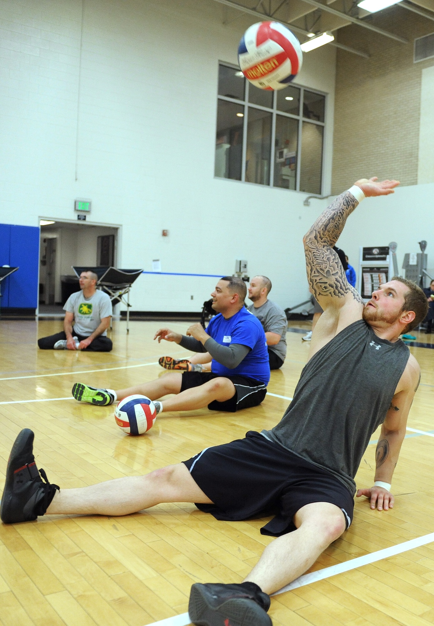Retired Senior Airman Brandon Bishop practices a volley during sitting volleyball, one of seven events that the Air Force Warrior Games team practiced for the week of April 15-19 in preparation for the 2013 Warrior Games. one of seven events that the Air Force Warrior Games team practiced for the week of April 15-19 in preparation for the 2013 Warrior Games. The Warrior Games is scheduled to take place May 11-16 at the Air Force Academy and U.S. Olympic Training Center in Colorado Springs, Colo. (U.S. Air Force photo/John Van Winkle)