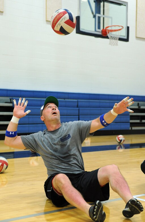 Master Sgt. Simon Wess practices his serve during sitting volleyball, one of seven events that the Air Force Warrior Games team practiced for the week of April 15-19 in preparation for the 2013 Warrior Games.   Wess is assigned to the 7th Civil Engineer Squadron at Dyess Air Force Base, Texas. The Warrior Games is scheduled to take place May 11-16 at the Air Force Academy and U.S. Olympic Training Center in Colorado Springs, Colo. (U.S. Air Force photo/John Van Winkle)