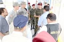 The Guatemalan Minister of Defense, Gen. Ulises Noe Anzueto Giron (pointing), talks to Maj. Gen. Frederick S. Rudesheim, U.S. Army South commanding general, along with other U.S. and Guatemalan military and government leaders at the international bridge connecting Guatemala and Mexico Apr. 10. Rudesheim visited Guatemala April 8 through 11 to meet with senior Guatemalan military and government. 