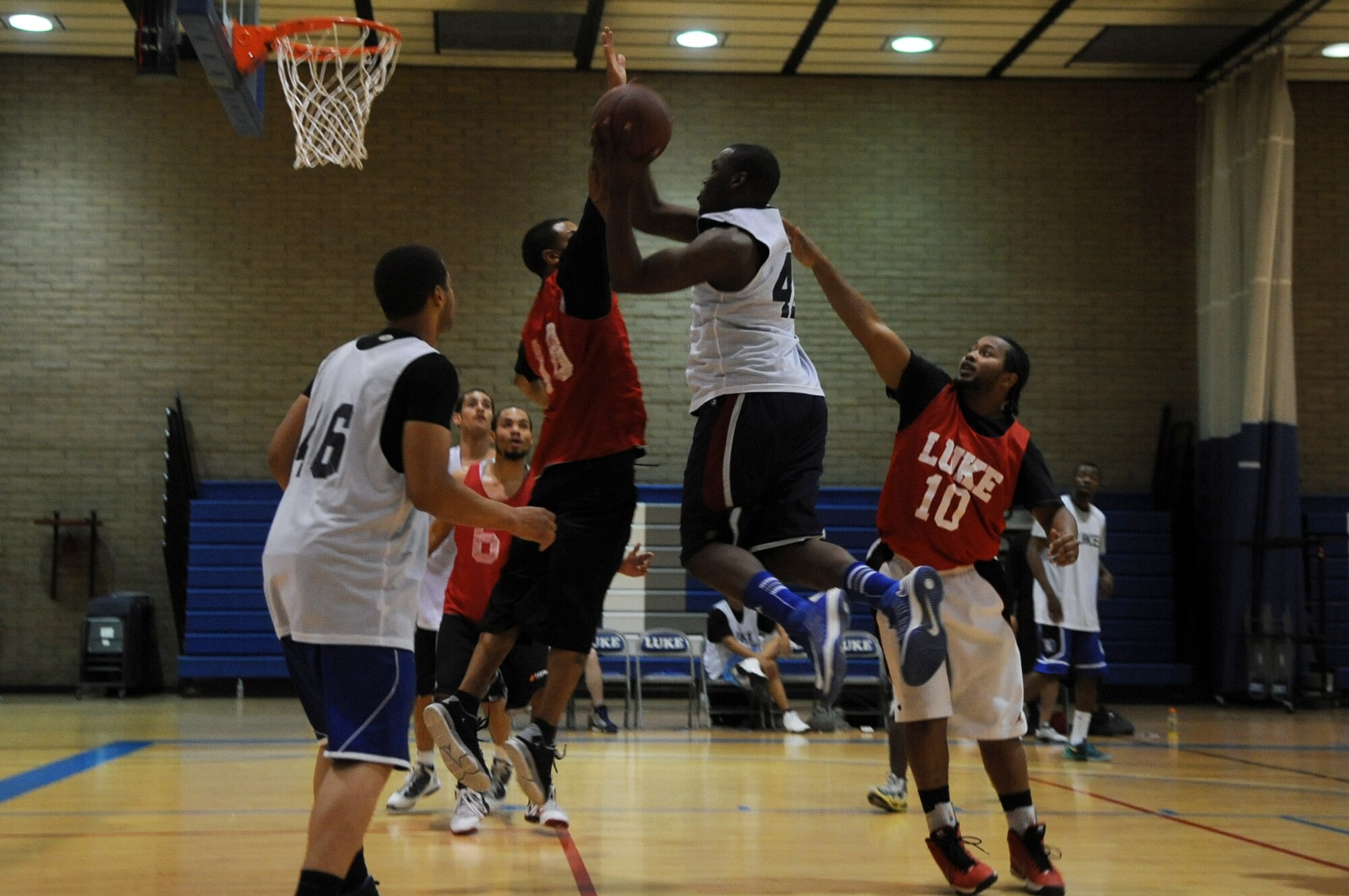 Patrick Paul, 56th Logistics Readiness Squadron, lays up the ball during the first intramural basketball championship game April 10 at the Luke Air Force Base Bryant Fitness Center gym. Paul scored 22 points in the game. (U.S. Air Force photo/Airman 1st Class Pedro Mota)