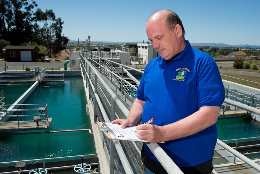 Roger Kasper, Travis Water Treatment Plant senior operator, surveys the quality of water April 17, 2013. The plant is capable of treating 7.5 million gallons of water per day. Kasper said personal and mission use average about 2.2 million gallons of water per day at Travis. (U.S. Air Force photo/ Ken Wright)
