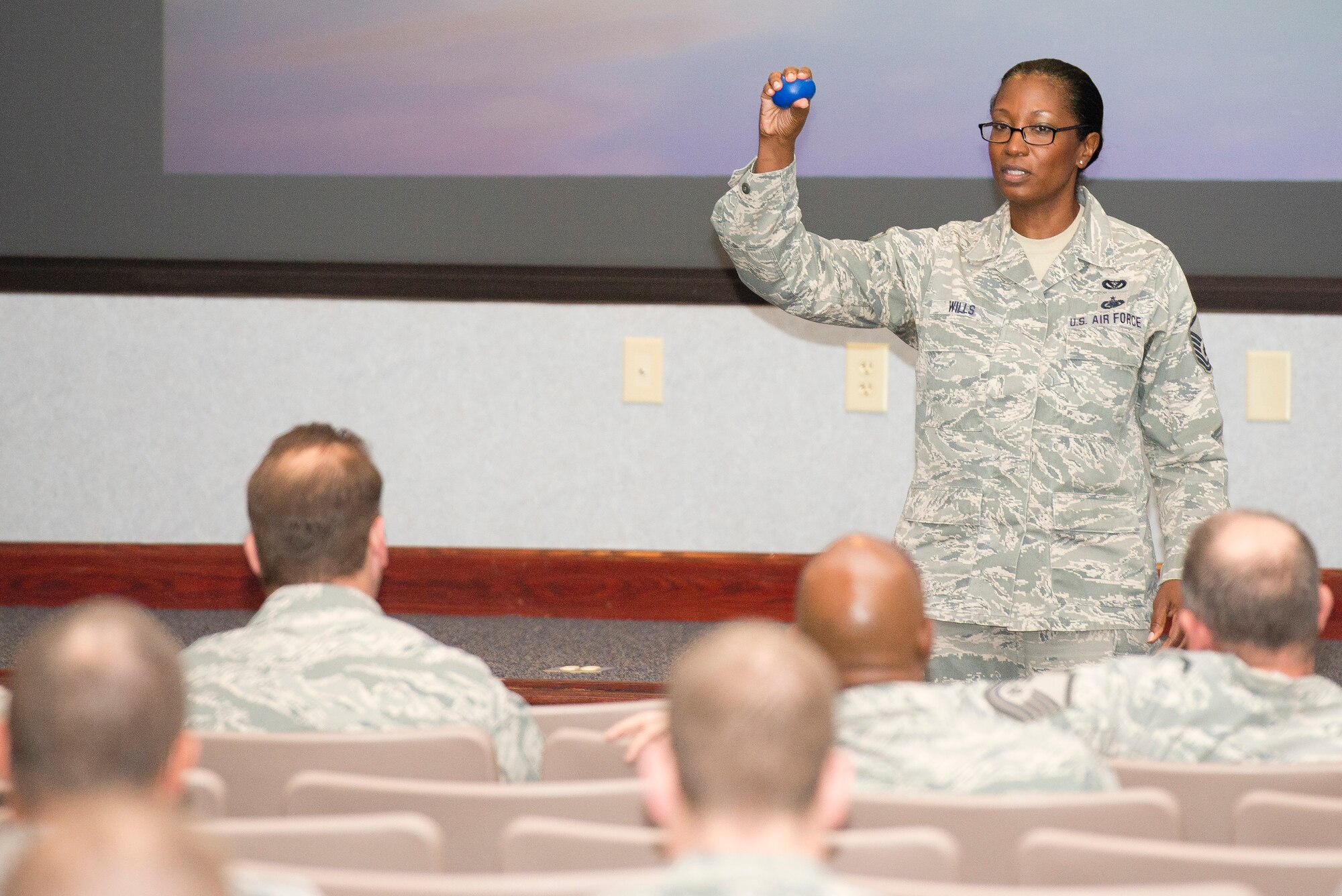 U.S. Air Force Master Sgt. Debra Wills, from the 116th Air Control Wing’s Civil Engineering Squadron, uses a rubber ball as a visual aid while sharing her story about resiliency with her fellow Airmen from the 116th ACW, Robins Air Force Base, Ga., April 12, 2013.  The Georgia Air National Guard wing took the day to focus on the resiliency of their Airmen, offering them training and information about the resources available to the Guardsmen and their families.  (U.S. Air National Guard photo by Master Sgt. Roger Parsons/Released)