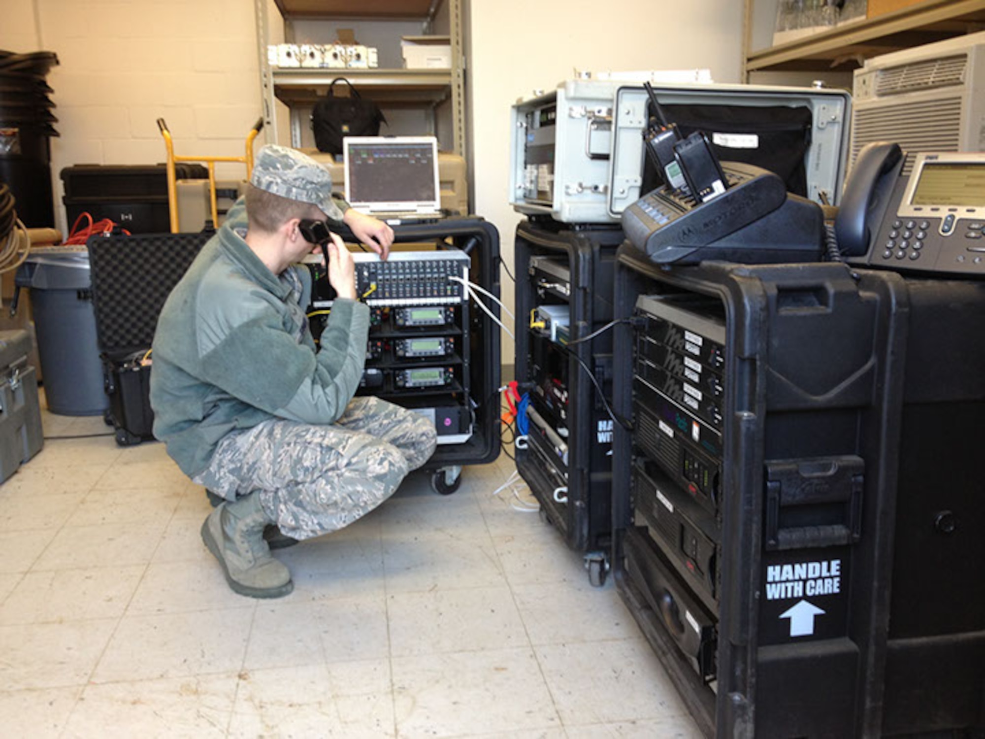 Airman First Class Adam Sines, 267th Combat Communications Squadron (267 CBCS), Massachusetts Air National Guard, stands up the Joint Incident Site Communications Capability (JISCC) facility at Boston Commons during the response efforts after the Boston Marathon Bombing, April 16. The JISCC provides local emergency responders with communications capabilities such as computers, web access and telephones. (U.S. Air National Guard photo by 1st Lt. Christopher Qubeck)