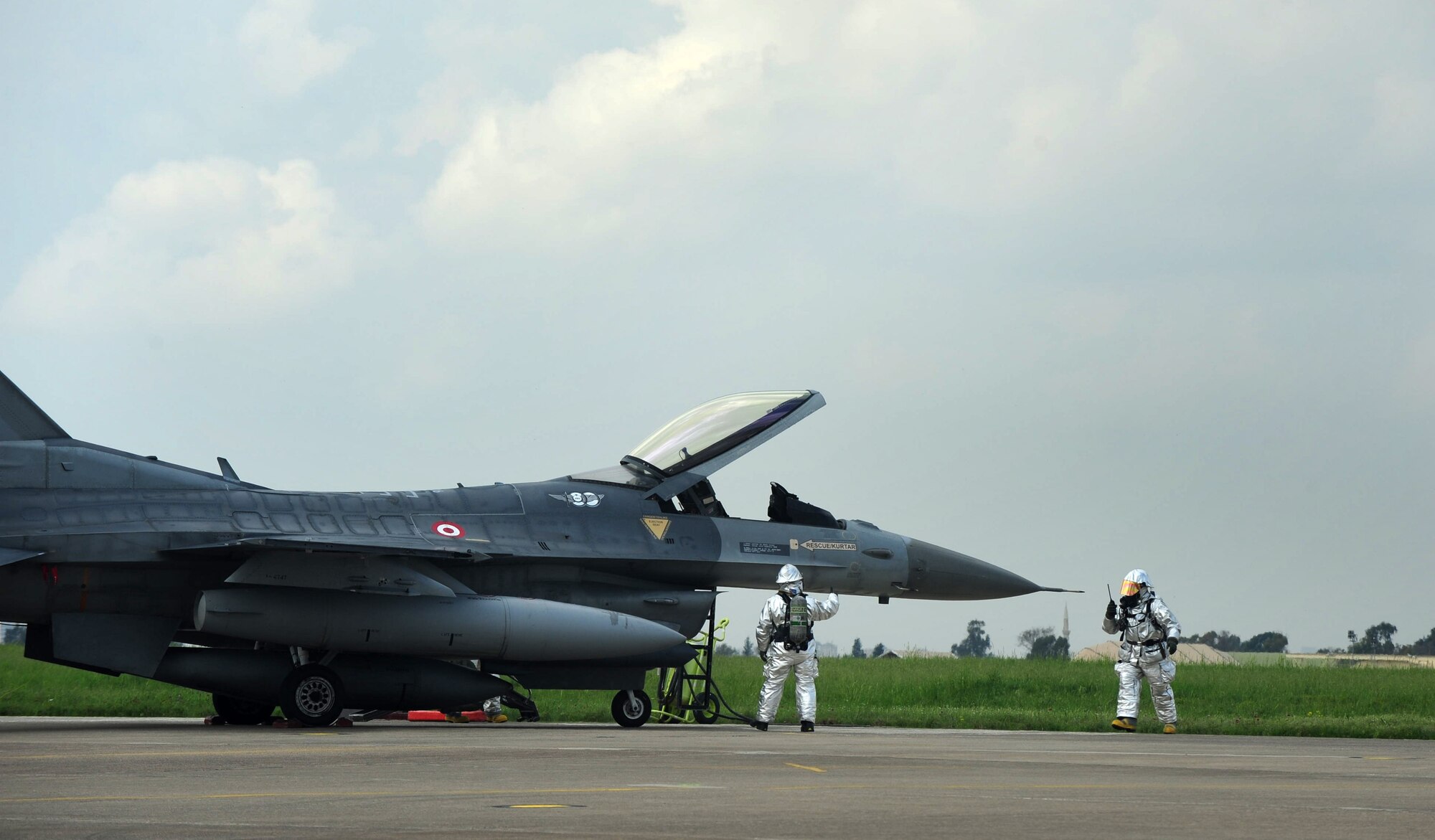 Members of the Turkish air force conduct an aircraft exercise April 11, 2013, at Incirlik Air Base, Turkey. The 39th Air Base Wing Safety office assisted during the scenario that simulated a broken landing gear on an F-16 aircraft. (U.S. Air Force photo by Senior Airman Anthony Sanchelli/Released)