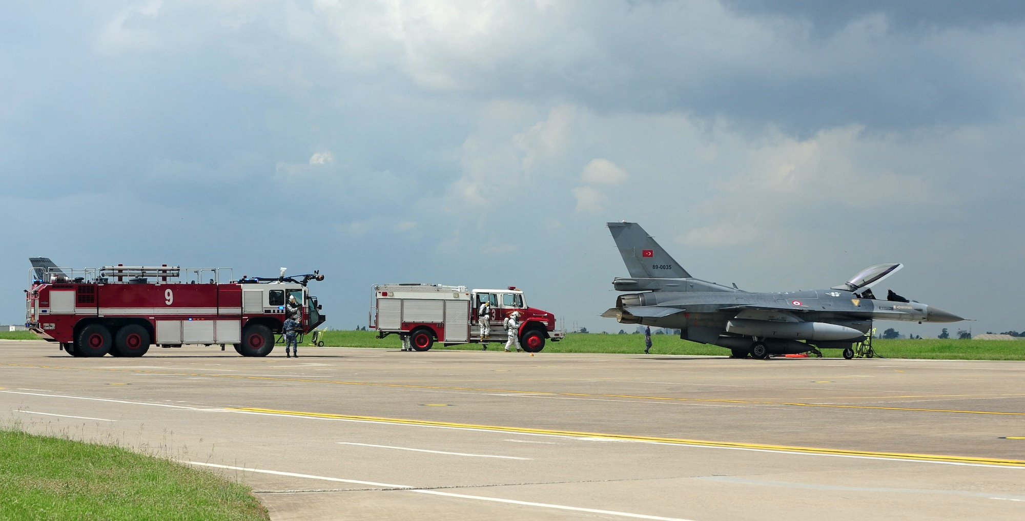Members of the Turkish air force conduct an aircraft exercise April 11, 2013, at Incirlik Air Base, Turkey. The 39th Air Base Wing Safety office assisted during the scenario that simulated a broken landing gear on an F-16 aircraft. (U.S. Air Force photo by Senior Airman Anthony Sanchelli/Released)
