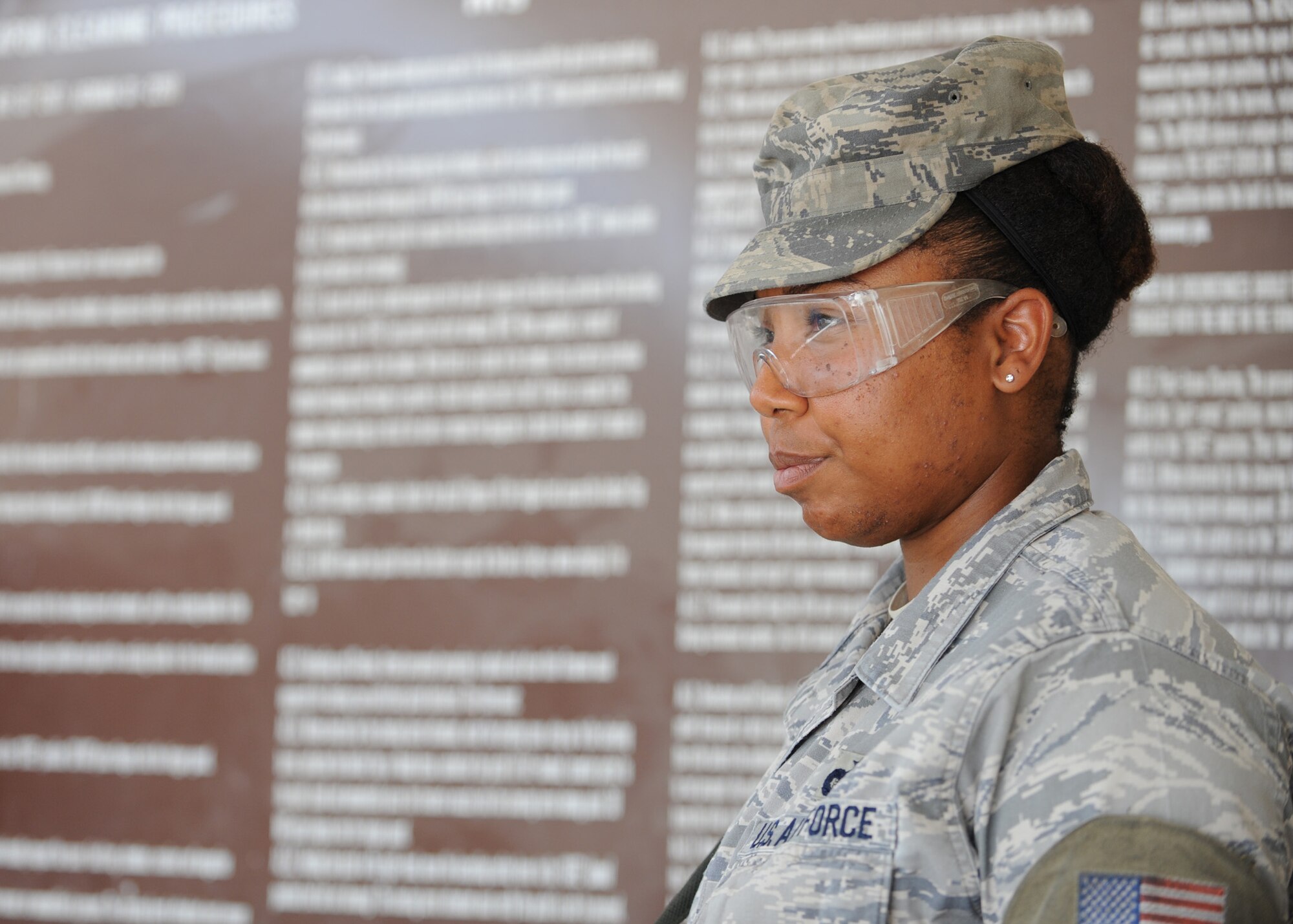 SOUTHWEST ASIA - Staff Sgt. Alynthia Boyd, 379th Expeditionary Security Forces Squadron, works as the clearing barrel attendent to supervise Defenders loading their weapons before the start of their shift, April 17. No one is allowed into the “clearing zone,” which is defined by four-inch red lines on the floor and six feet from the front of the clearing barrel, until she informs the Airman to proceed. Clearing barrel procedures are posted in front of the “clearing zone” to remind Airman of the rules to safely load or clear their weapons. (U.S. Air Force photo/Staff Sgt. Joel Mease)
