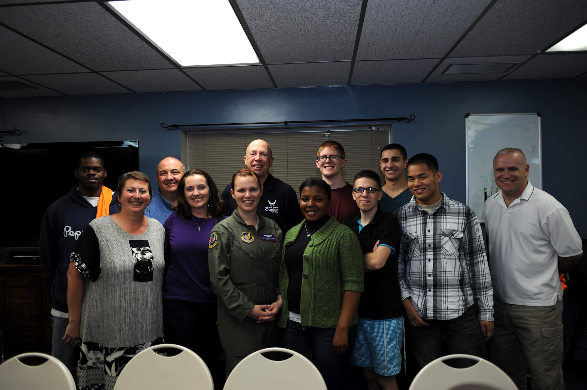Members of the Wired Bean, a chapel-sponsored establishment, participate in a group photo on Kadena Air Base, Japan, Jan. 25, 2013. The 18th Wing chaplain corps was recently awarded the Large Chapel Organization of the Year Award at the Air Force level. Melissa Rafferty, Wired Bean activities coordinator, also won the Air Force Chaplain Corps Civilian of the Year award. (U.S. Air Force photo by Airman 1st Class Hailey R. Davis/Released)