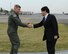 YOKOTA AIR BASE, Japan -- U.S. Air Force Brig. Gen. Jerry Harris Jr., 5th Air Force vice commander, shakes hands with Itsunori Onodera, Japanese Minister of Defense, before he takes off April 19, 2013, at Yokota Air Base, Japan. Military leaders from U.S. Forces, Japan, 5th Air Force, the 374th Airlift Wing and the Japan Self-Defense Force greeted Onodera during a brief visit to Yokota. The Air Defense Council headquarters relocated to Yokota in 2012 to enable the U.S. Air Force and Japan Self-Defense Force alliance to have fewer barriers to effective communication and improve bilateral interoperability, contingency planning, training and cultural understanding.  (U.S. Air Force photo by Airman 1st Class Desiree Economides)
