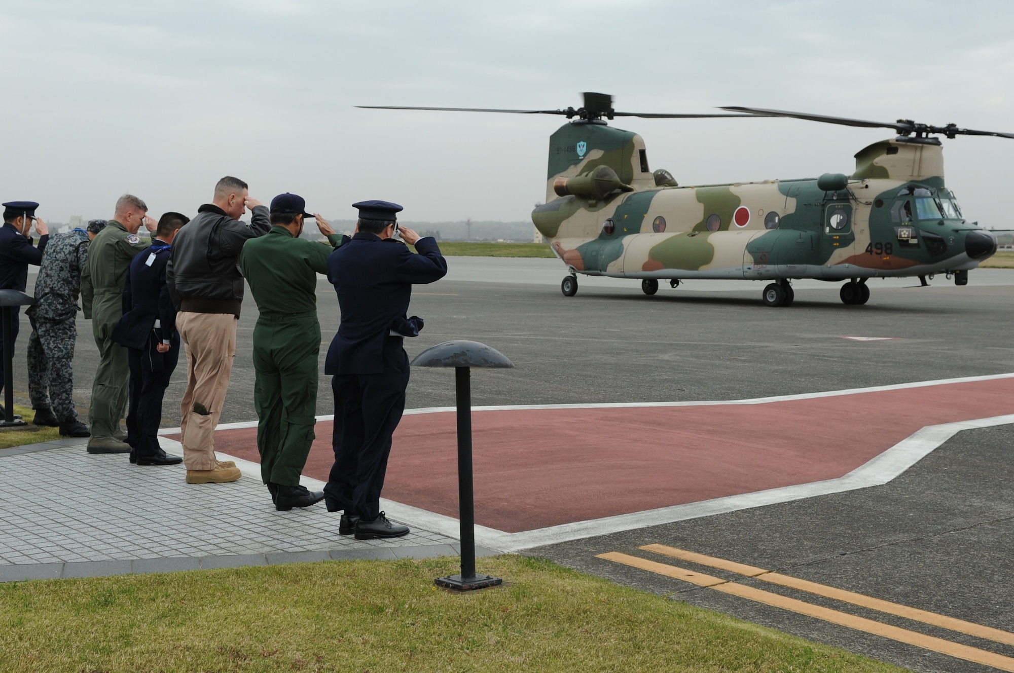 YOKOTA AIR BASE, Japan -- Military leaders from U.S. Forces, Japan, 5th Air Force, the 374th Airlift Wing and the Japan Self-Defense Force salute upon the arrival of the Japan Minister of Defense,  Itsunori Onodera, April 19, 2013, at Yokota Air Base, Japan. The Minister of Defense stopped at Yokota for a brief visit to the Japan Air Defense Command Headquarters. The Air Defense Council headquarters relocated to Yokota in 2012 to enable the U.S. Air Force and Japan Self-Defense Force alliance to have fewer barriers to effective communication and improve bilateral interoperability, contingency planning, training and cultural understanding.  (U.S. Air Force photo by Airman 1st Class Desiree Economides)